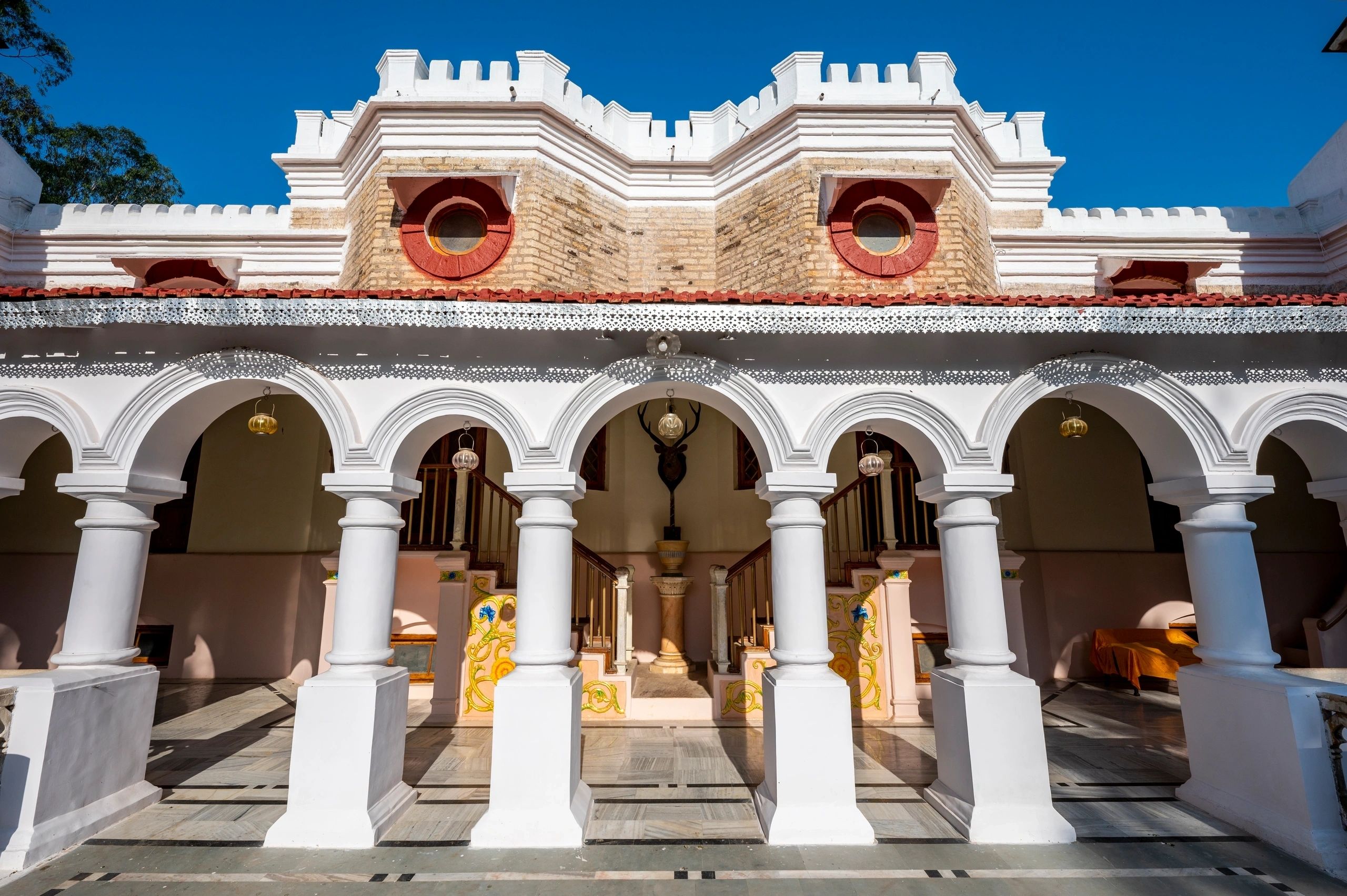 Colonial architecture with white columns and arches