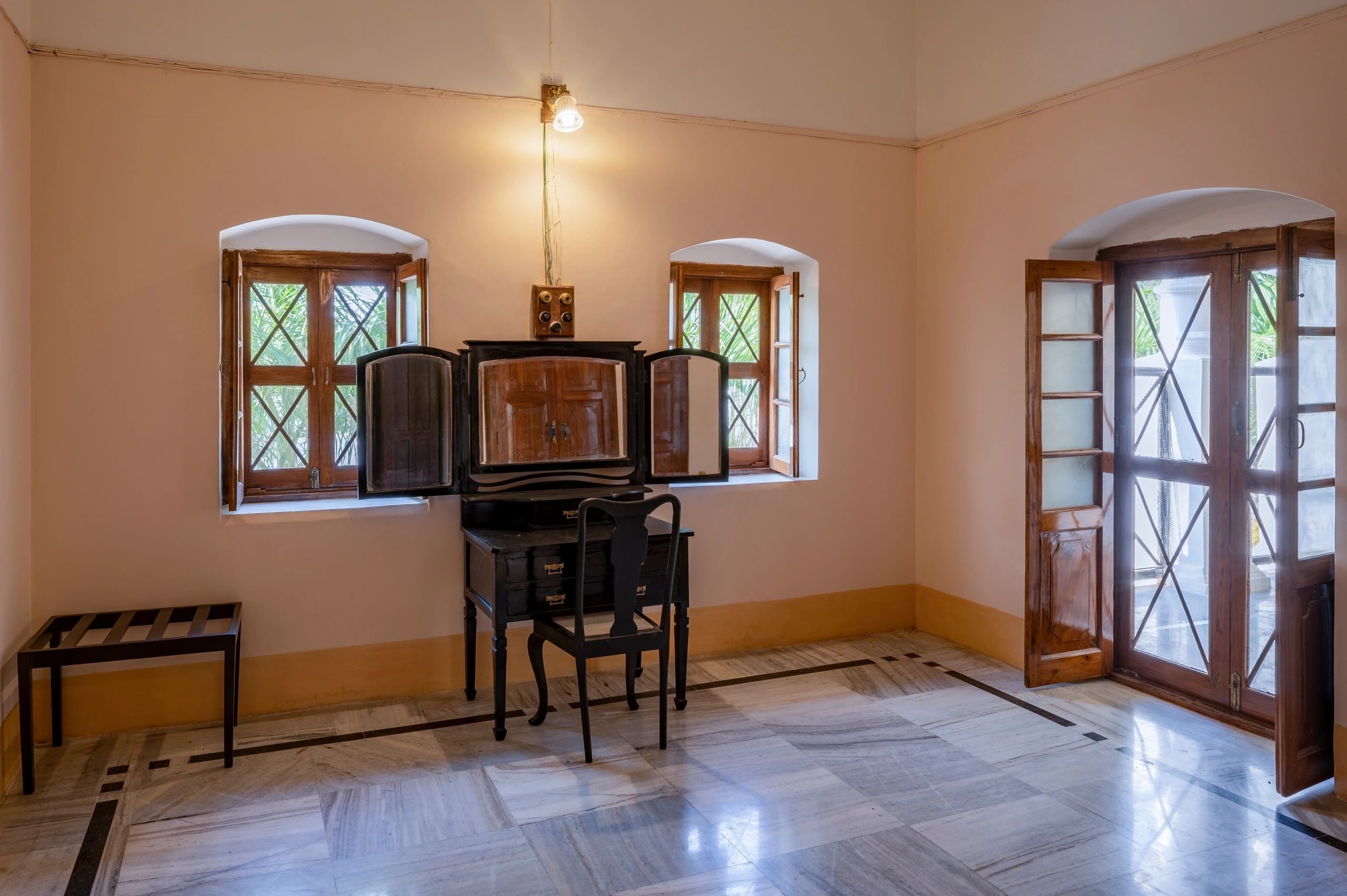 Minimalist period bedroom with vanity mirror
