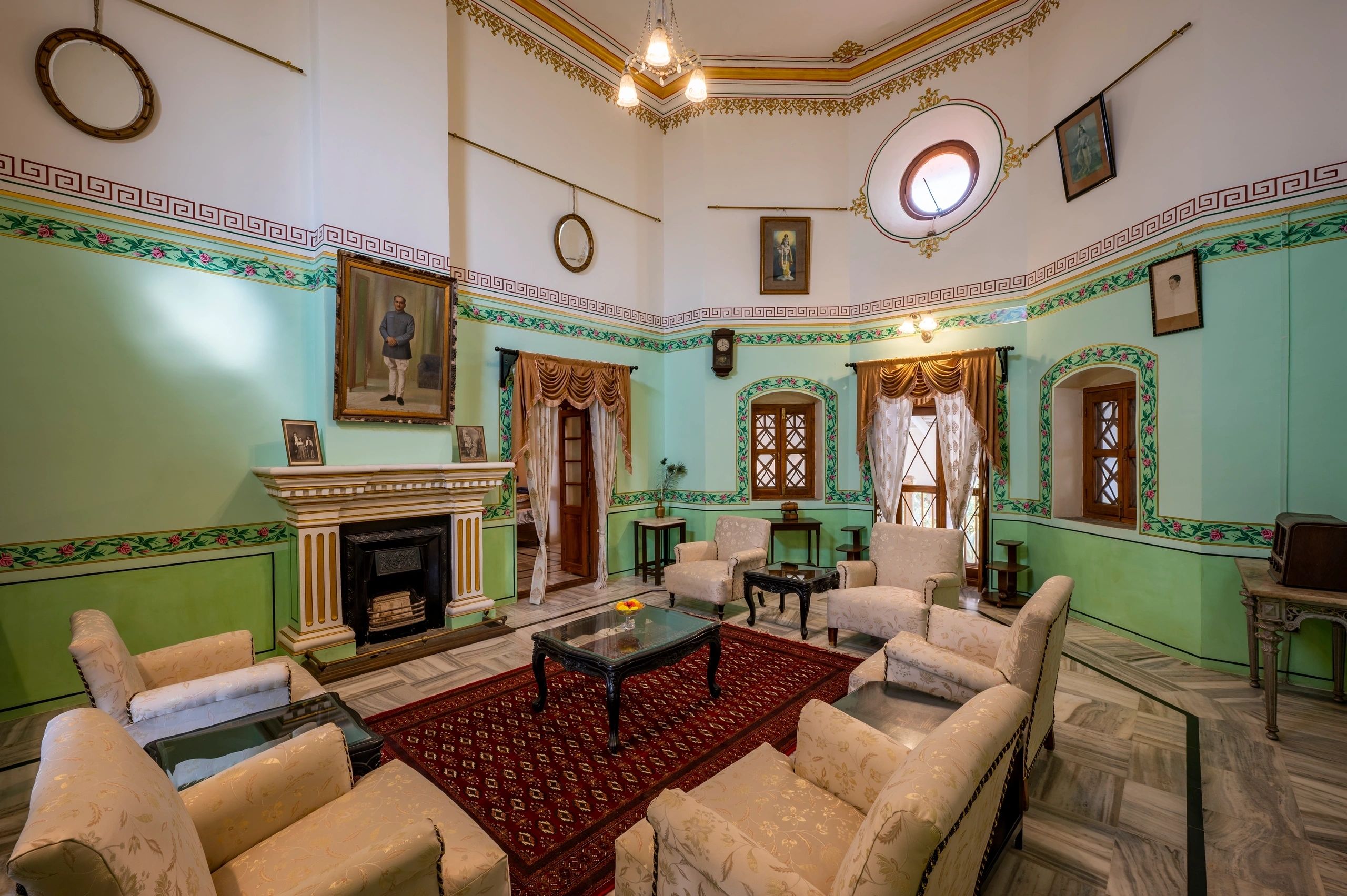 Ornate heritage drawing room with mint green walls and gold accents
