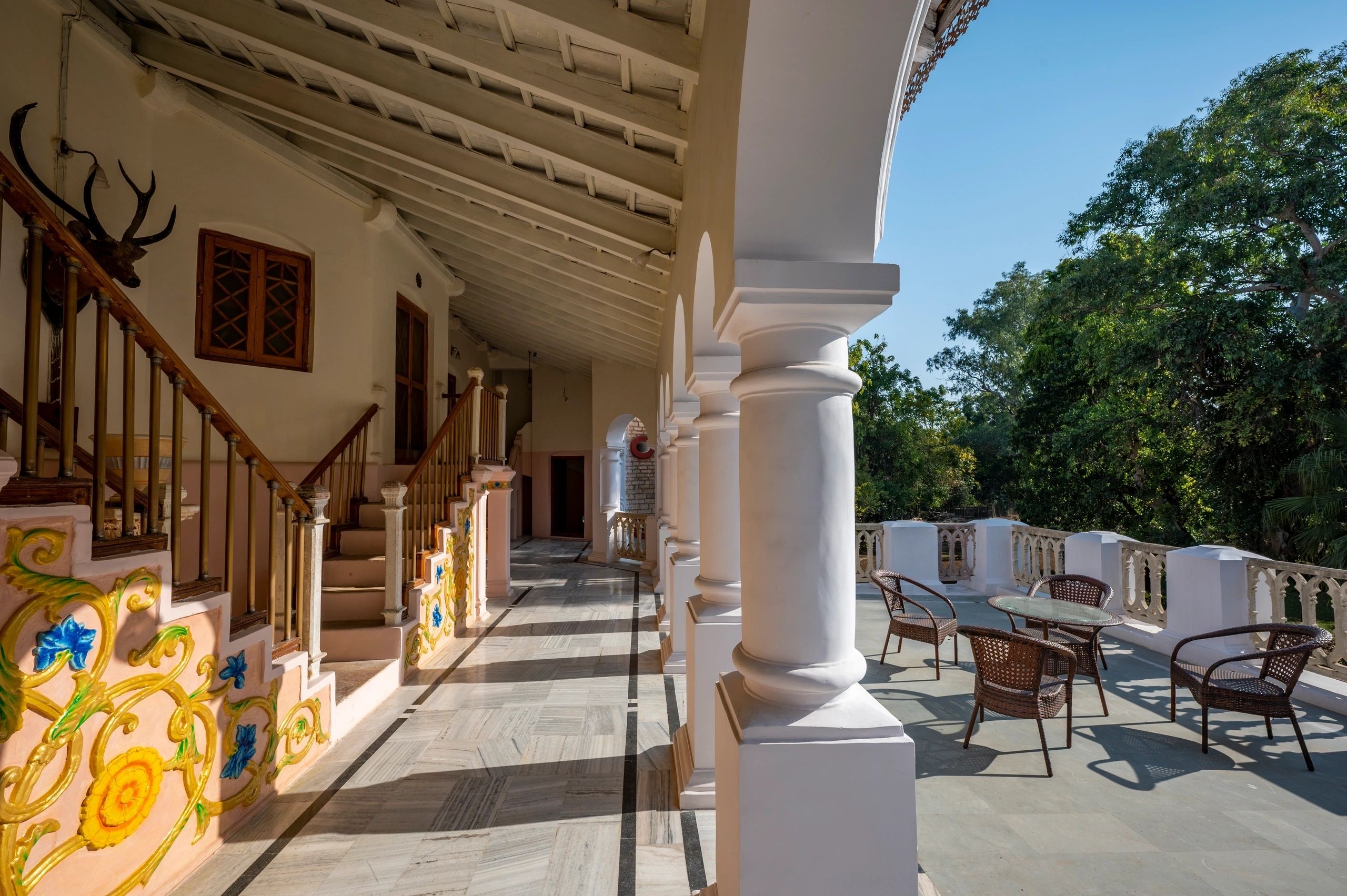 Colonial terrace with columns and outdoor seating